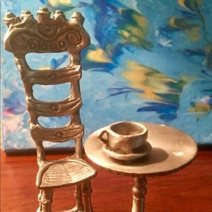 DON DRUMM PEWTER TABLE WITH  A HIGH BACK CHAIR.